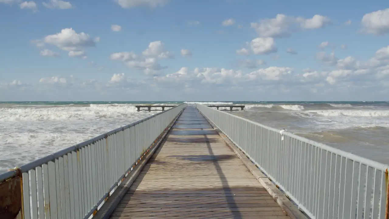 Wild Mediterranean Sea Winter Waves and Cloudy Sky by the Pier in Cyprus Slow Motion