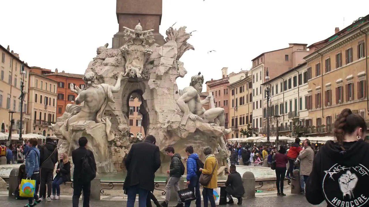 People Walking Around Piazza Navona Fountain