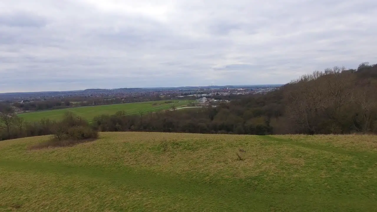 Colwick park on a cloudy day in Nottingham UK Establishing aerial drone shot lifting up