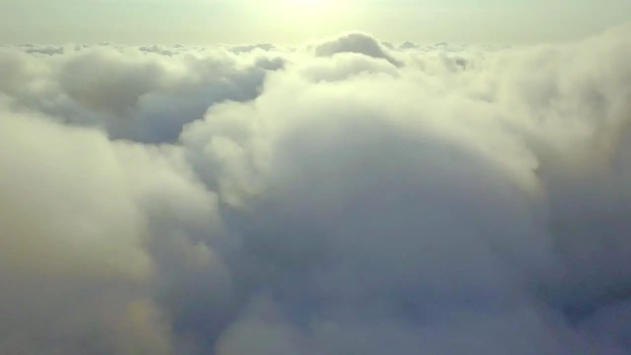 fly over the clouds on an sunny morning