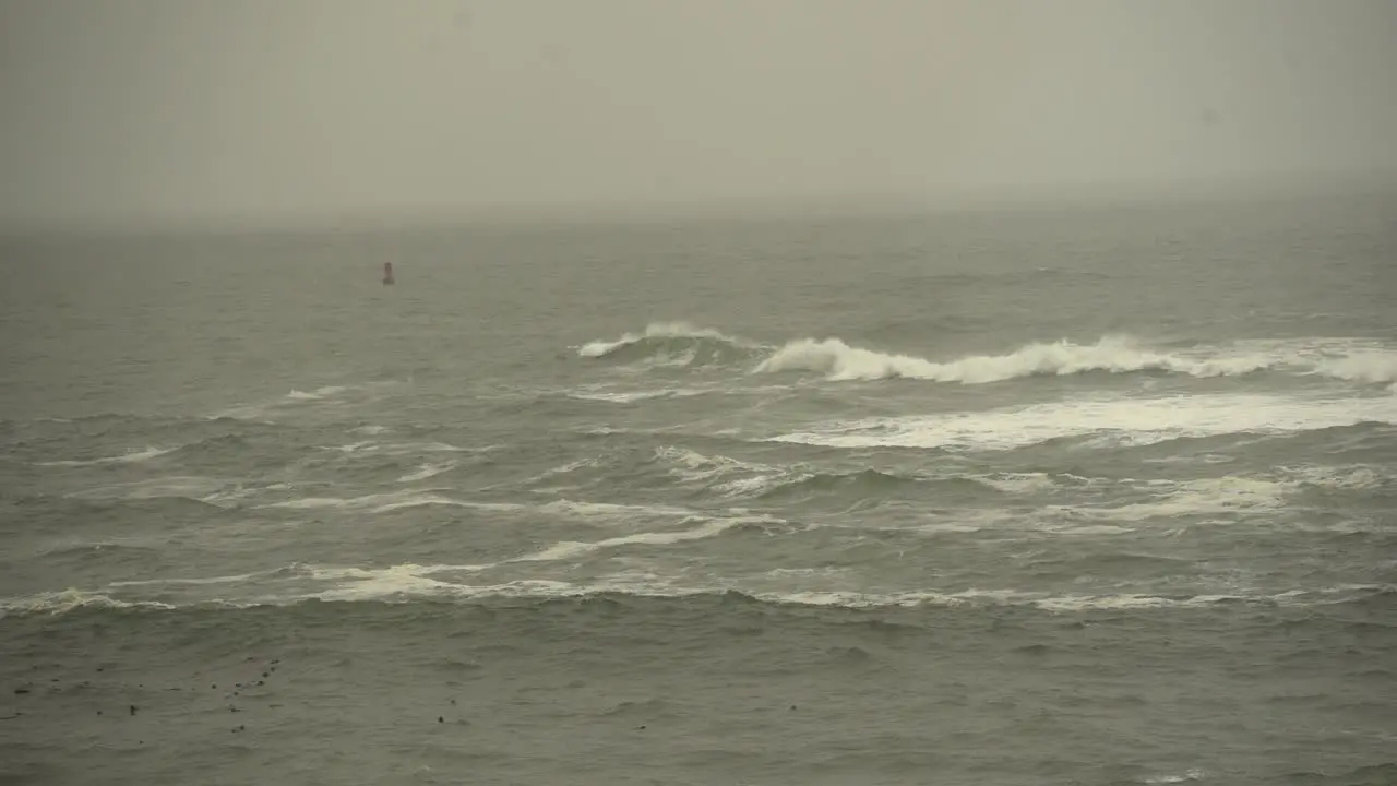 waves crash amid rough ocean conditions