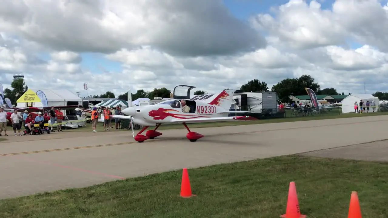 small airplane taxiing by runway