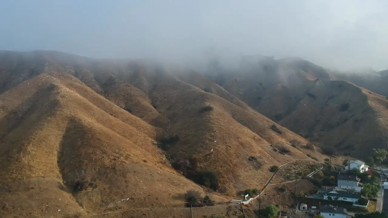 Drone footage of foggy mountains over Big Tujunga canyon in Los Angeles California