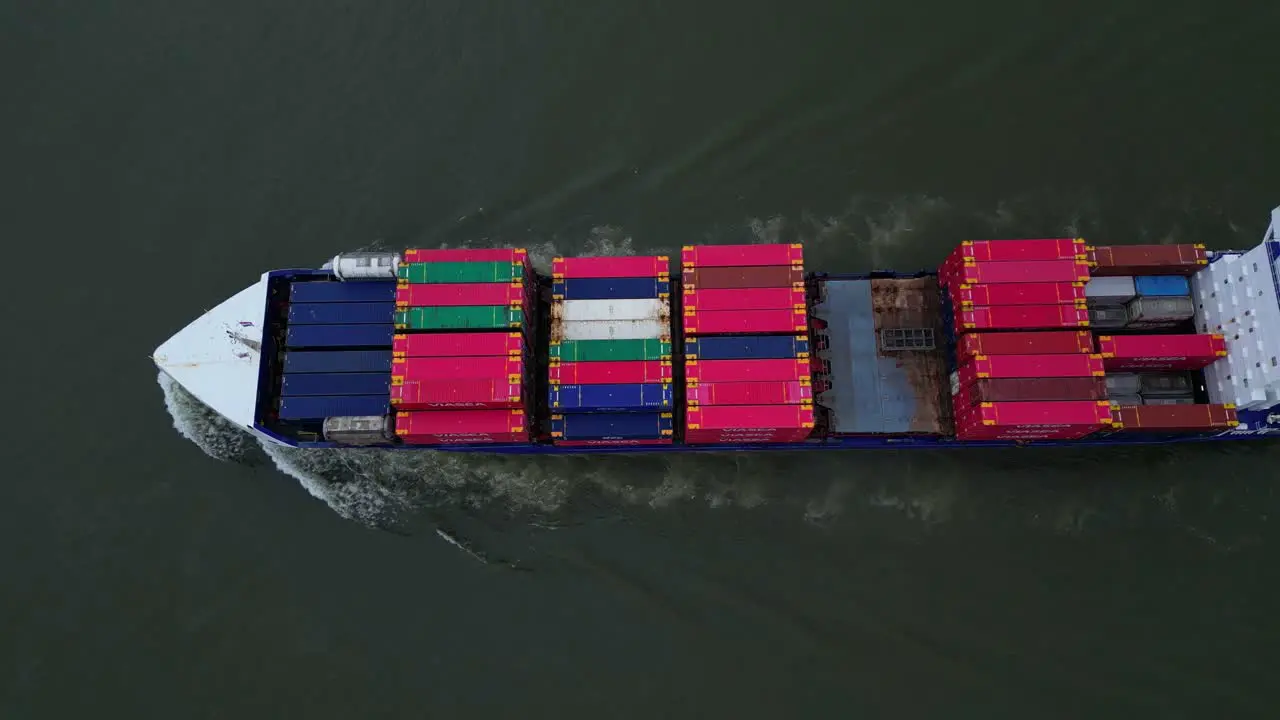 Aerial Birds Eye View Over Energy Cargo Ship Carrying Viasea Intermodal Containers Passing Along Oude Maas