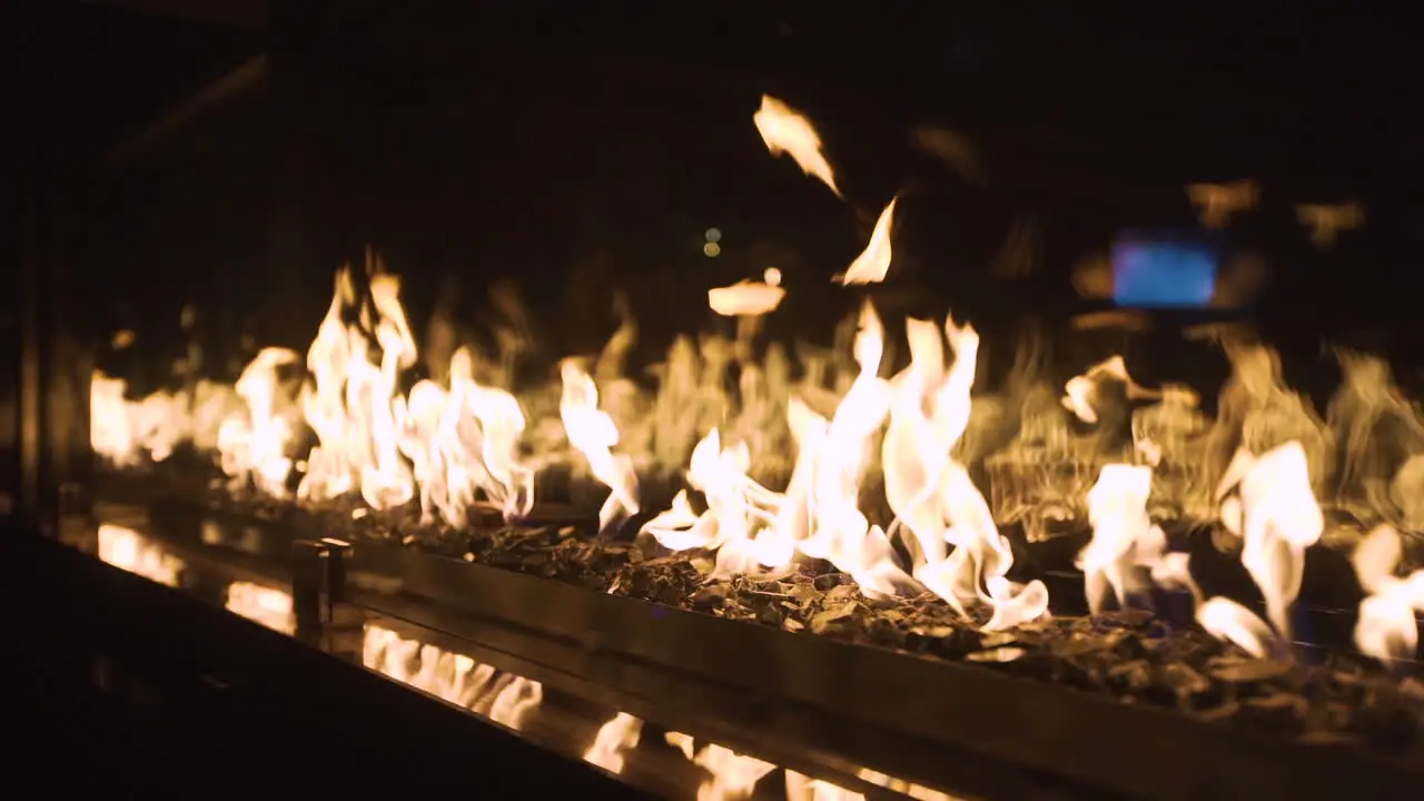 Cinematic flames at a fancy restaurant