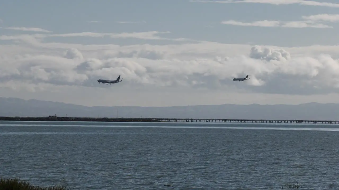 2 airplanes landing side by side