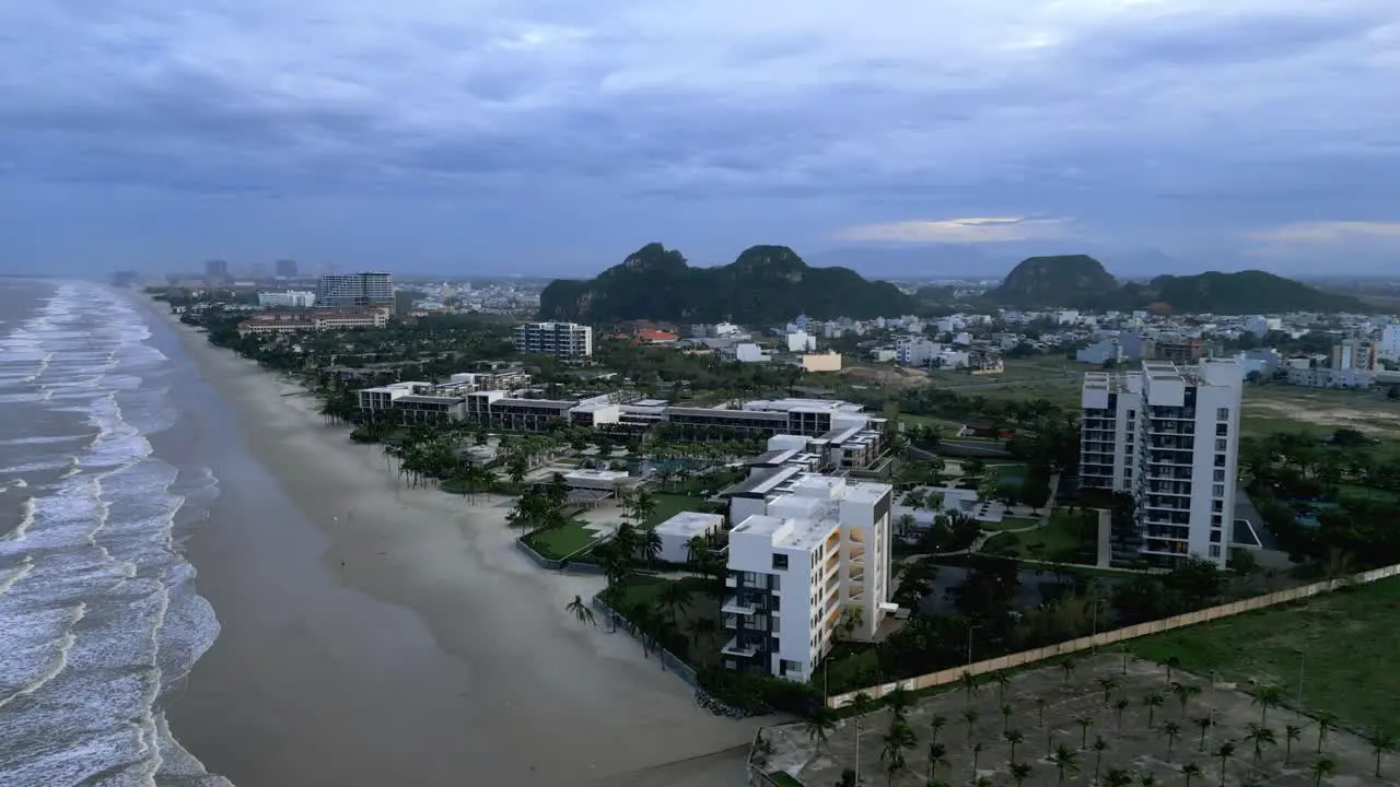 Beautiful aerial drone shot of An Bang Beach and the buildings in Vietnam on a cloudy day