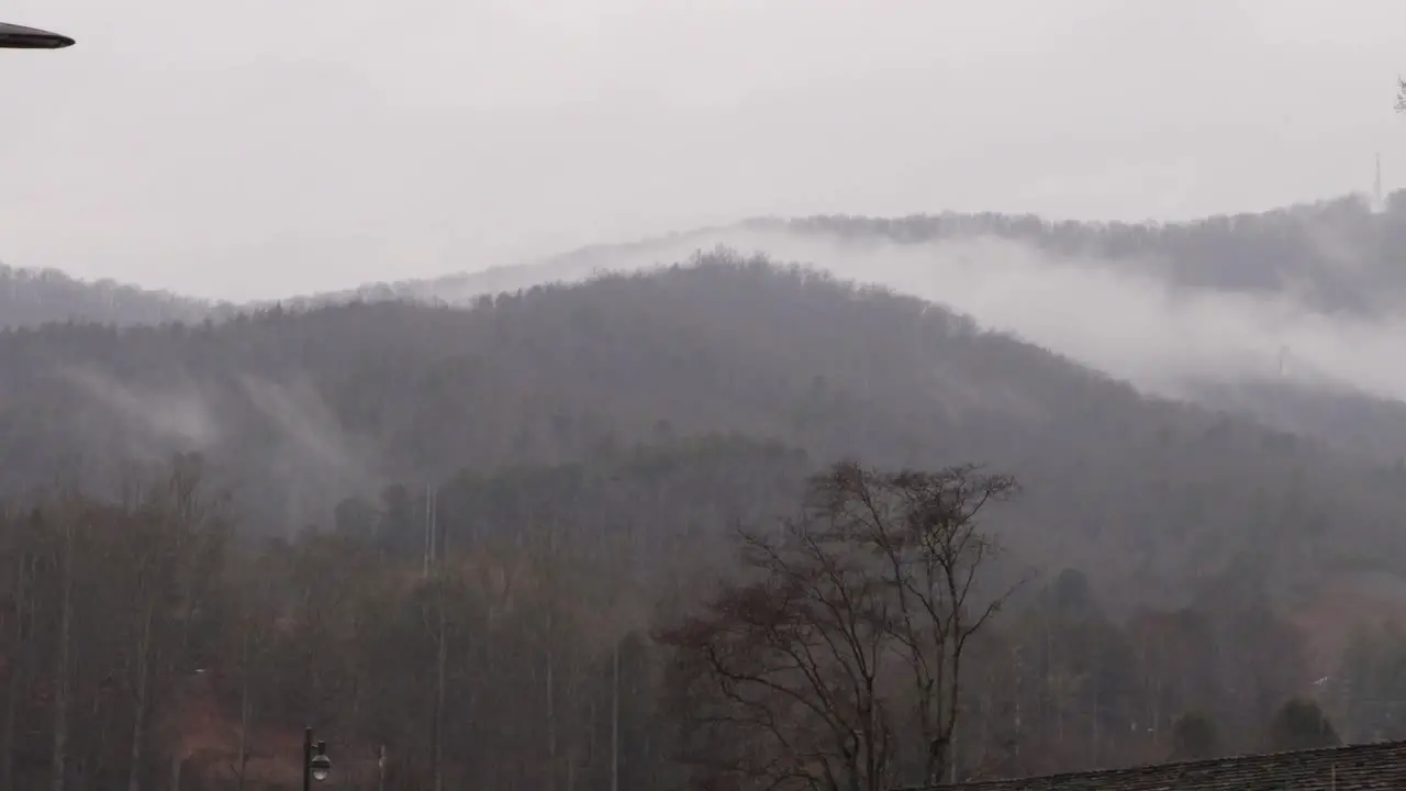 Fog and rolling over a mountain on a rainy day in the mountains