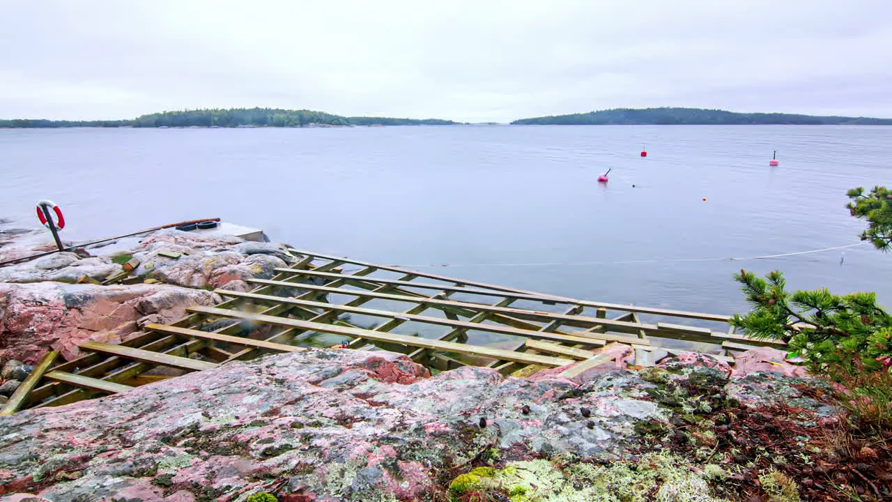 Time-lapse of workers building a terrace on cliff by the sea cloudy and rainy day