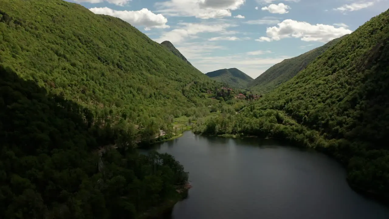 beautiful view of a small lake between mountains