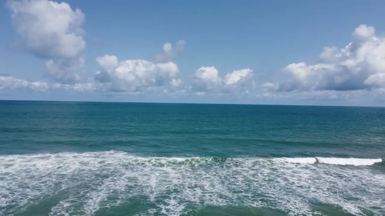 Wavy Beach Front And Beautiful Landscape Of The Sea And The Sky