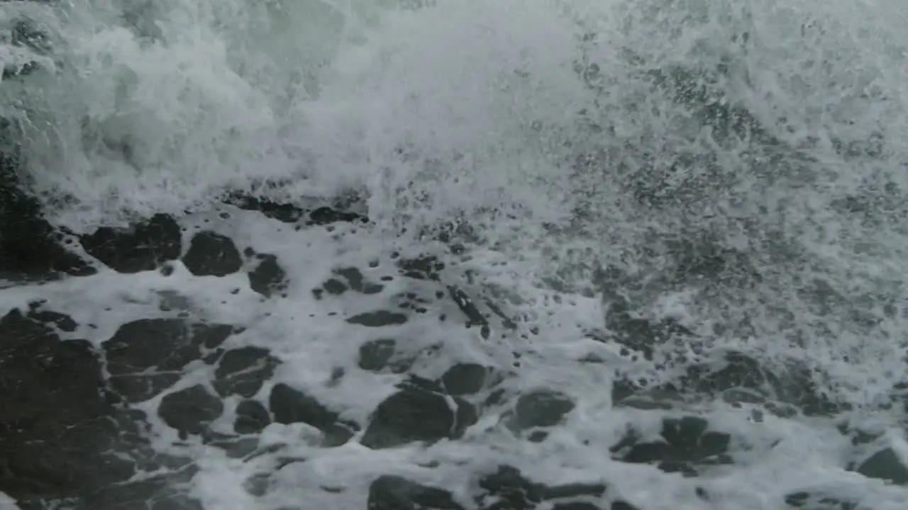 Epic wave burst of drops on foamy water