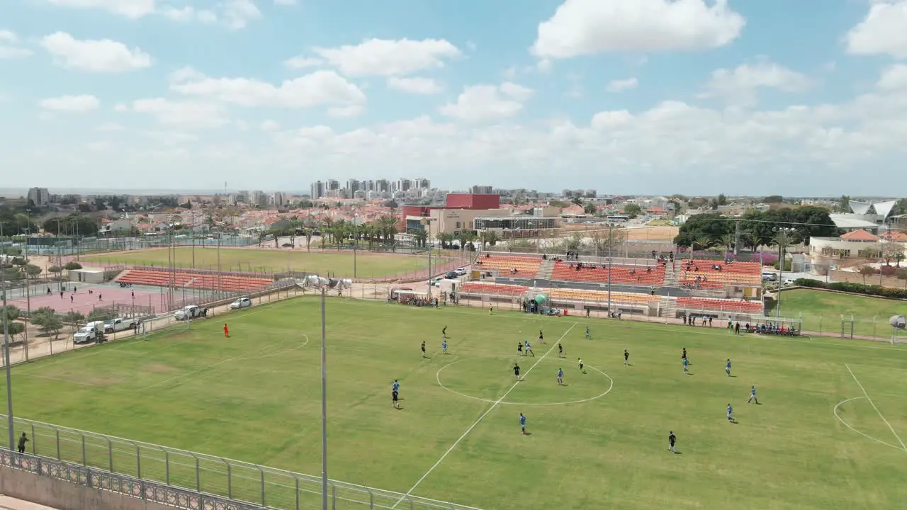 soccer game at noon shot from above at netivot city