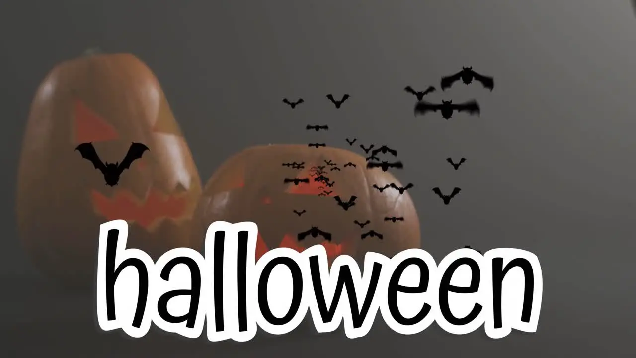 Halloween text banner and multiple flying bat icons over halloween pumpkins against grey background