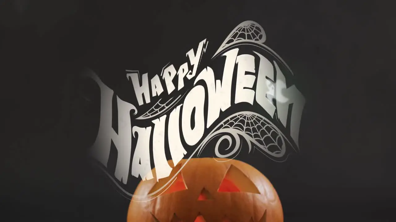 Happy halloween text banner and multiple ghosts icons against smoke effect over halloween pumpkin