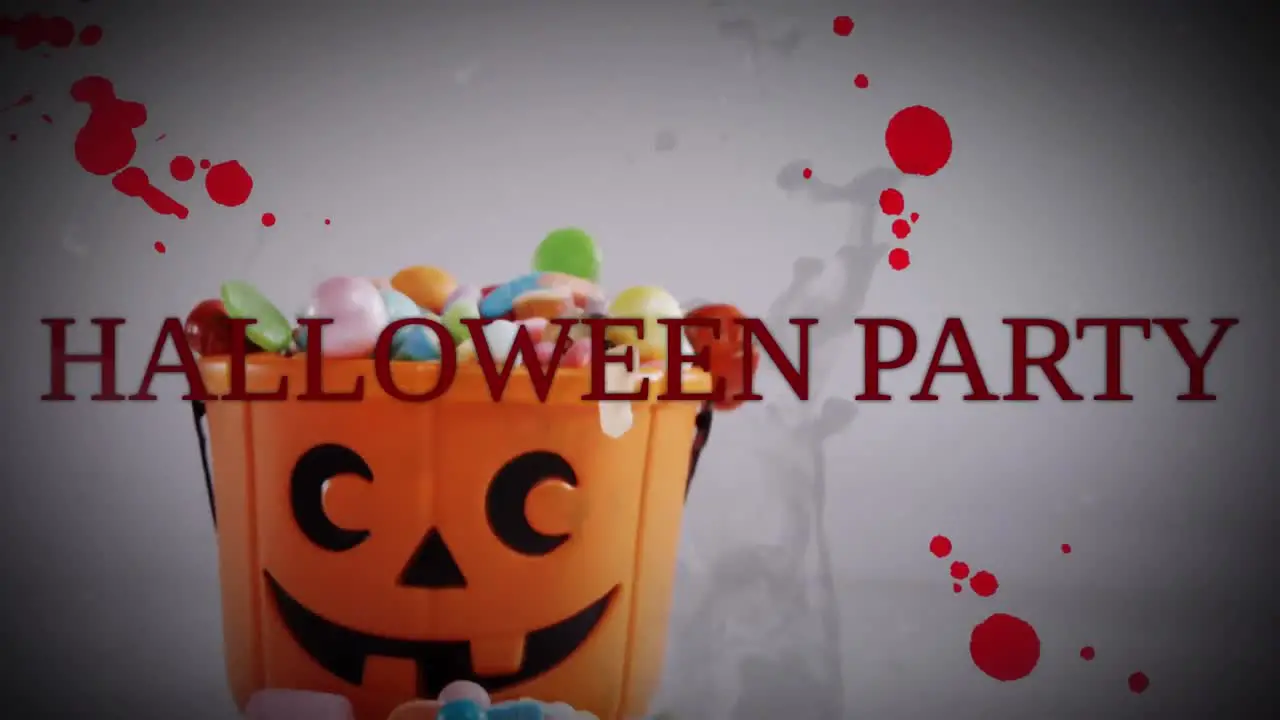 Animation of halloween party and blood stains over candies in background