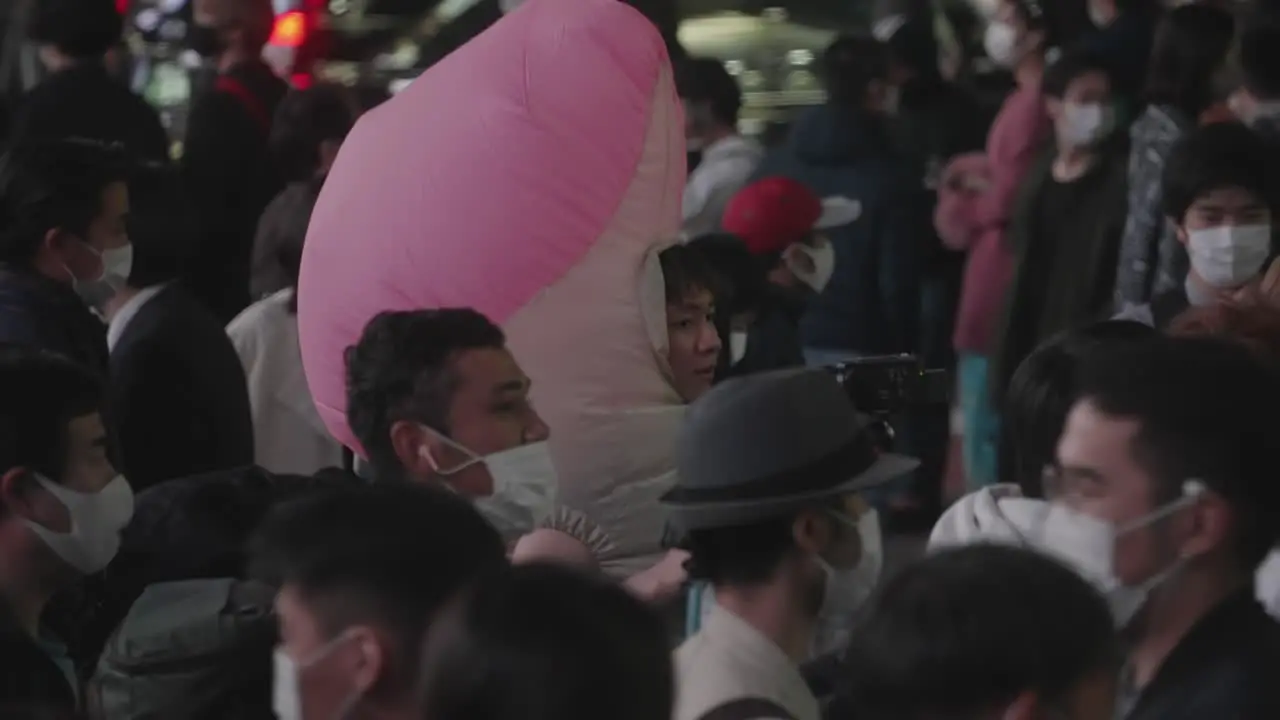 Japanese Guy In A Dick Costume Strolling At Shibuya Crossing In Tokyo Japan On Halloween Night slow motion