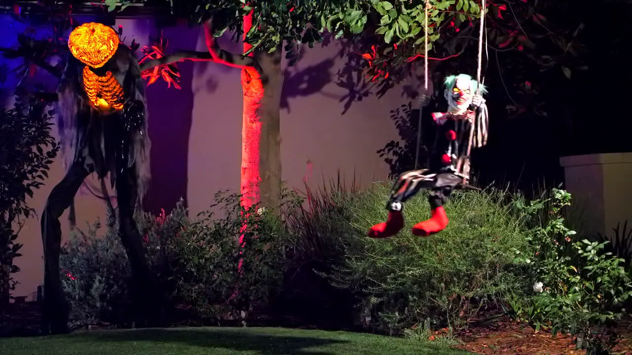 Swinging clown and pumpkinhead Halloween decorations and animatronics