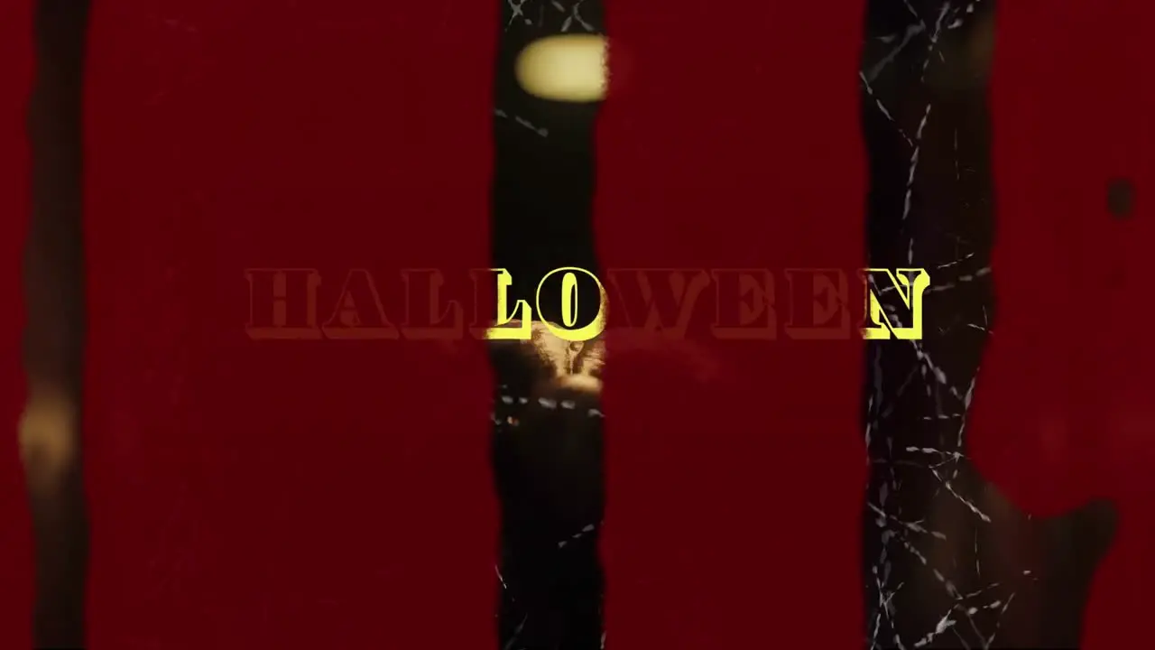 Animation of halloween text in yellow with blood and scratches over scary zombie in dark corridor