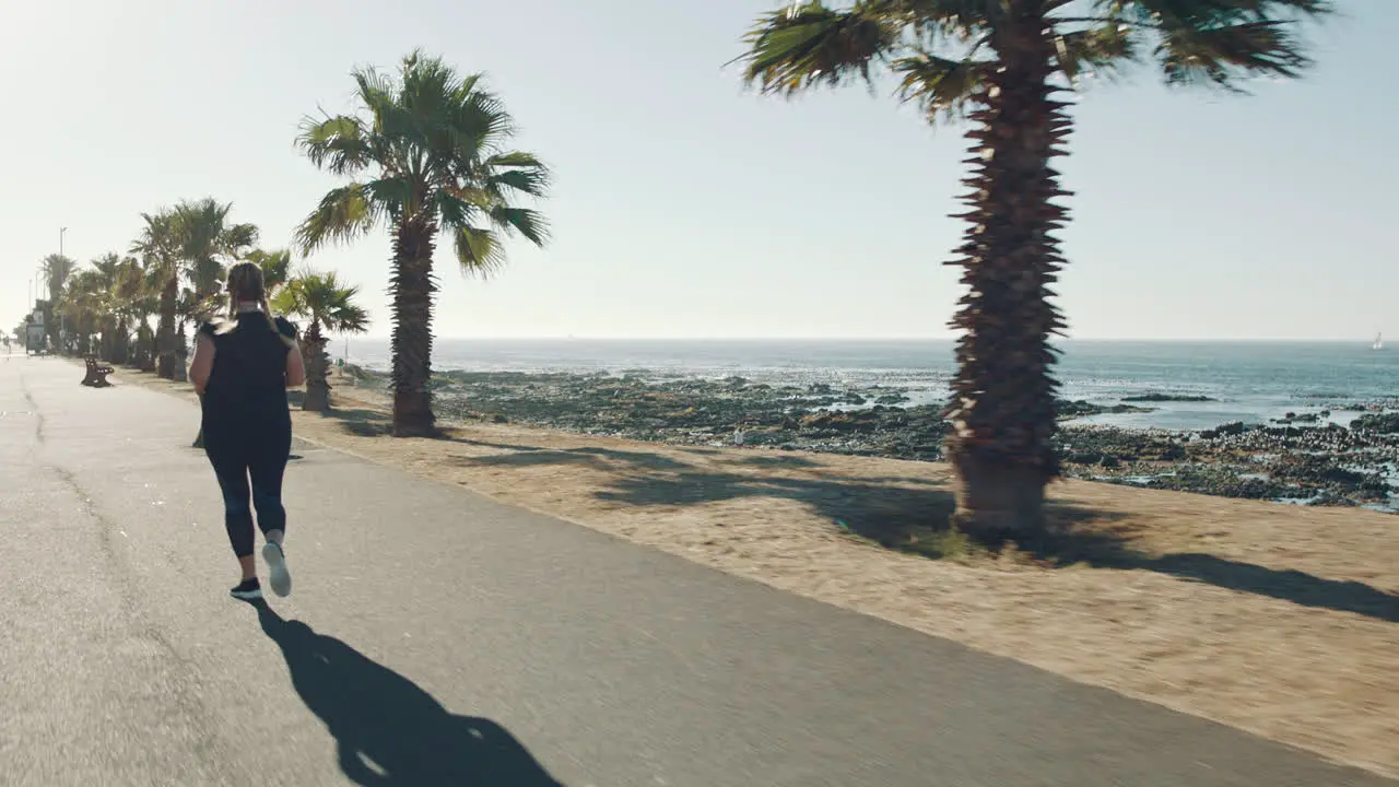 Beach back view and plus size woman running to