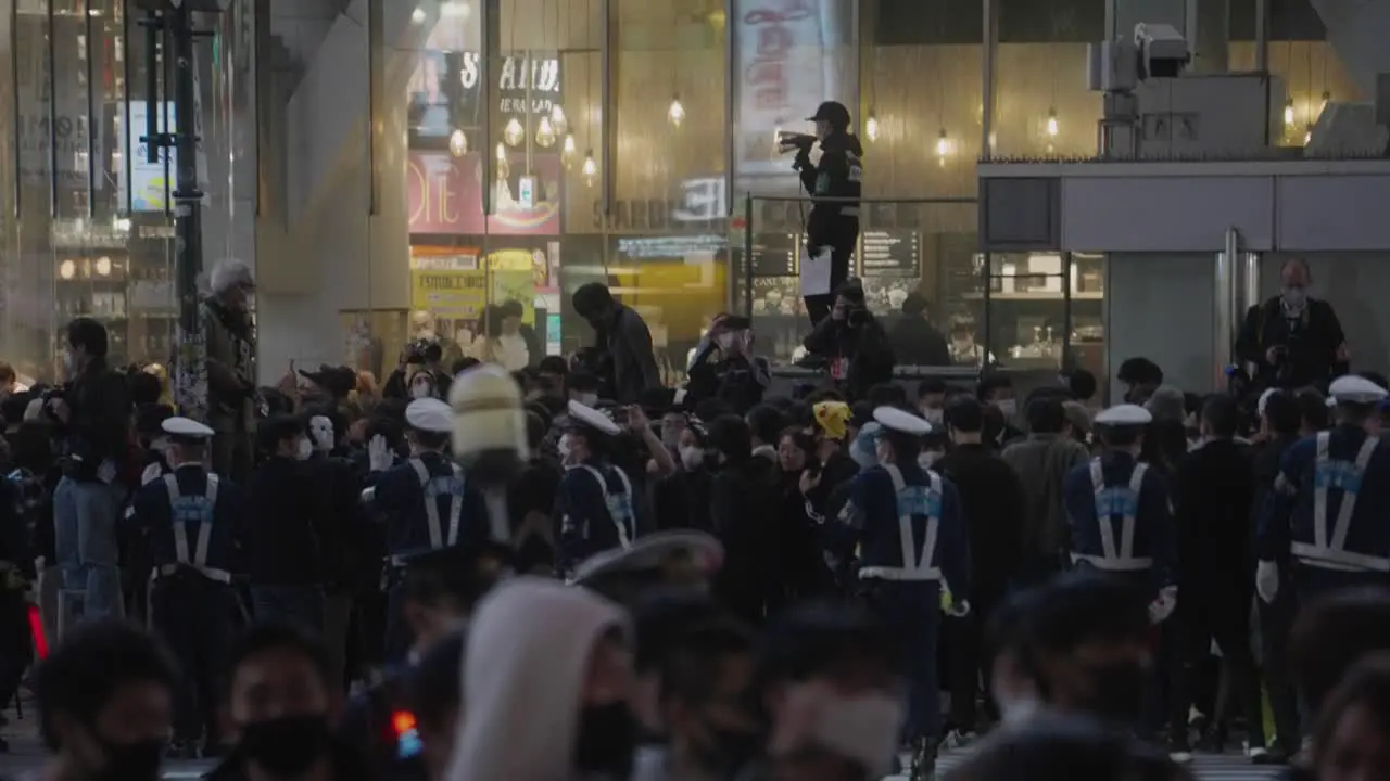 Uniformed Cops Roving Around Controlling The Massive Crowd On Halloween Night 2020 At Shibuya Crossing In Tokyo Japan Slow Motion