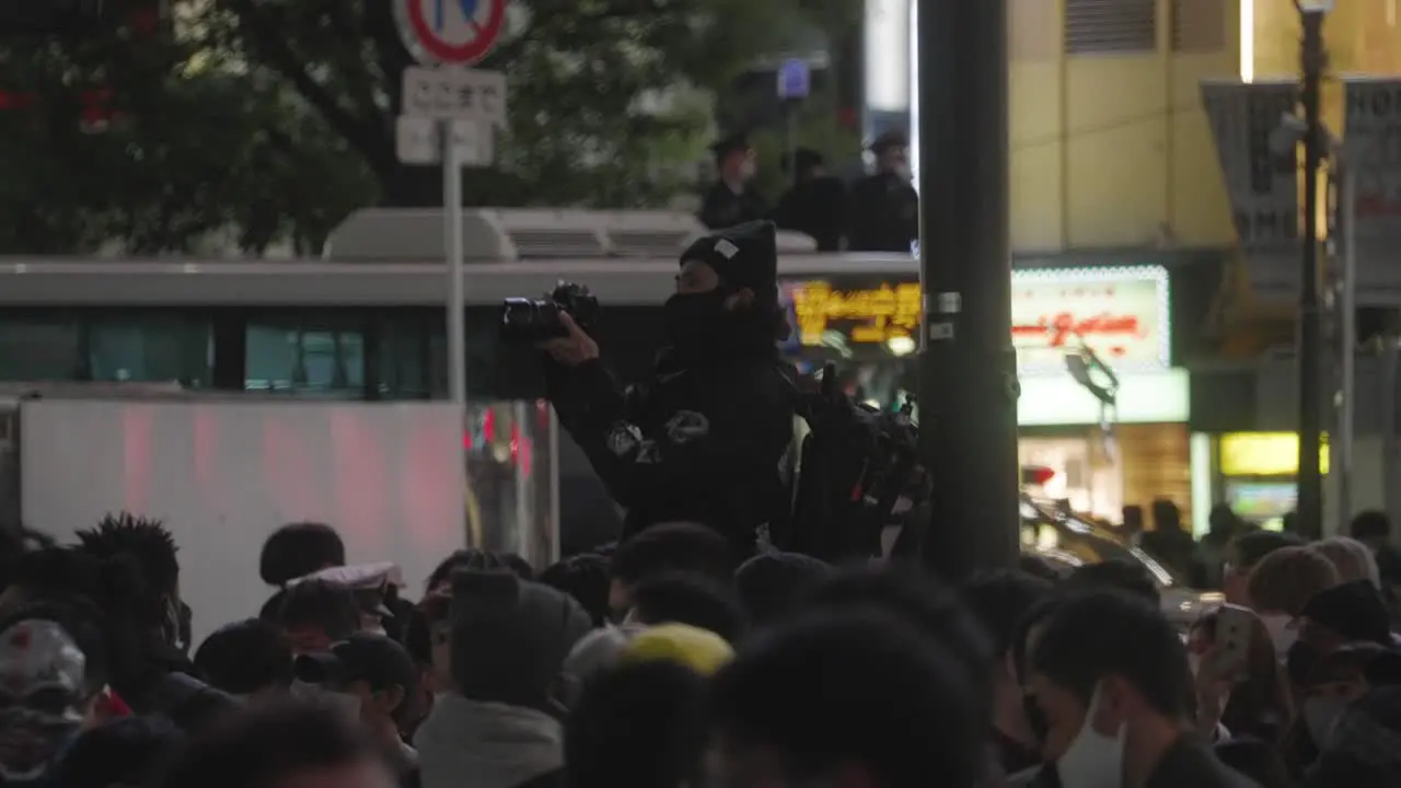 Shibuya Halloween Night A Male Photographer Taking Photos Along The Busy Crowd At Shibuya Crossing In Tokyo Japan Medium Shot Slow Motion