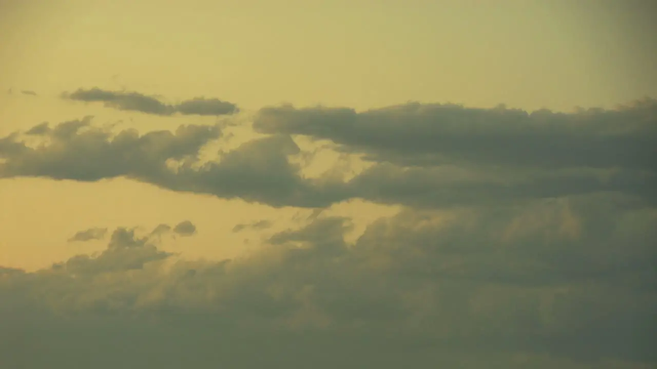 Time Lapse Clouds Travel Across A Sunsetting Sky