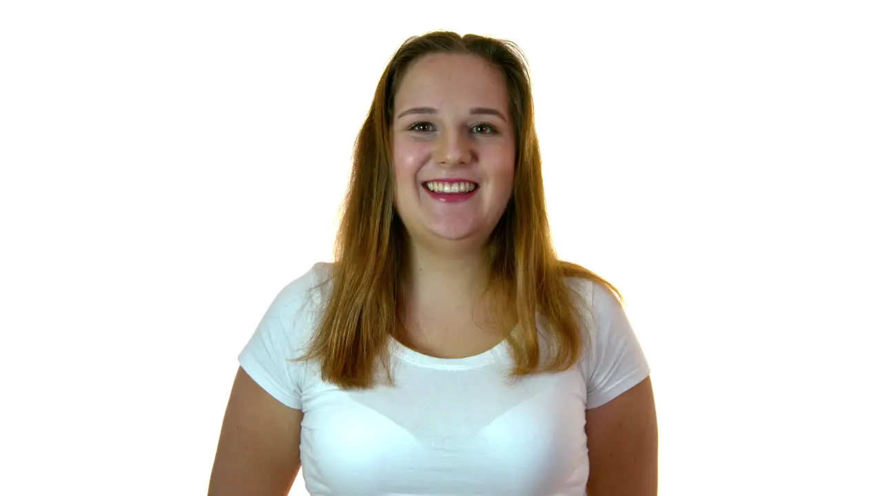 Portrait of the cheerful smiling obese woman in the studio on a white background