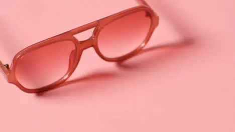 Summer Holiday Concept Of Sunglasses On Pink Background