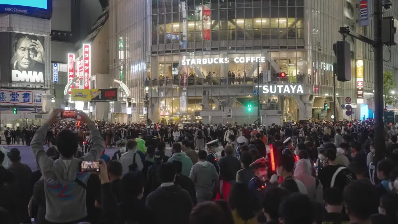 Huge Crowd Attending The Annual Halloween Night Festival At Shibuya Crossing In Tokyo Japan Medium Shot