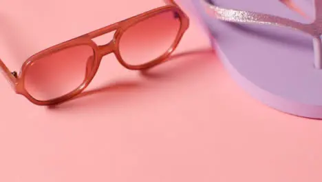 Summer Holiday Concept Of Sunglasses And Flip Flops On Pink Background 3