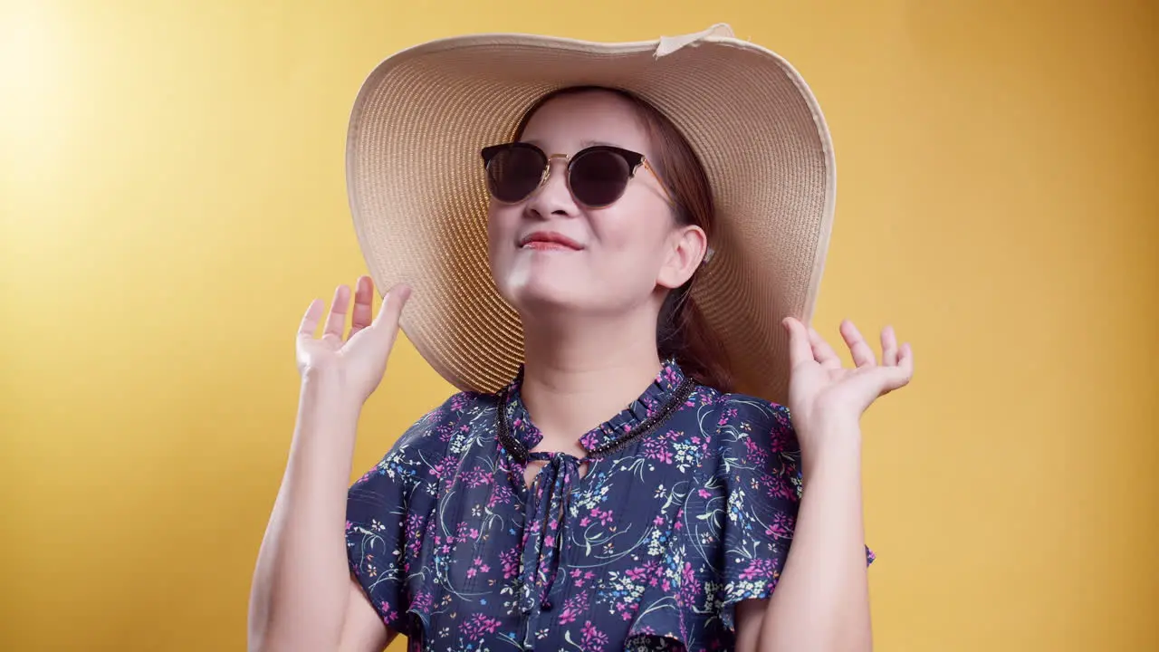 Excited Asian beauty woman with sunglass and good