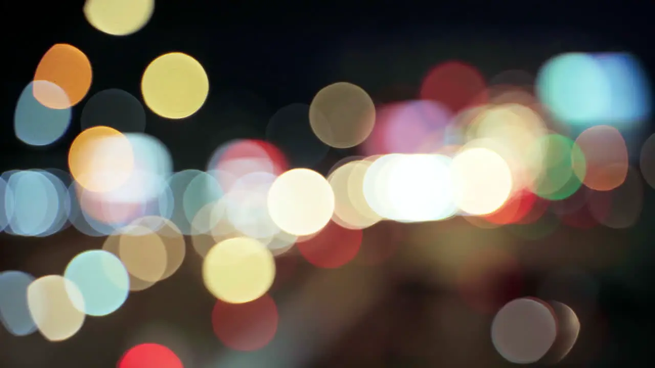 Night road lights blurred bokeh of cars in traffic on the road at night