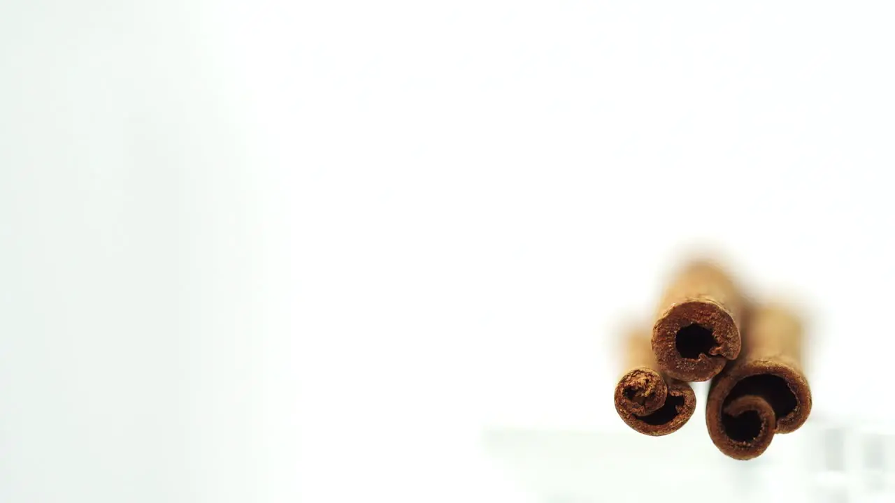 Macro shot of three cinnamon sticks stacked