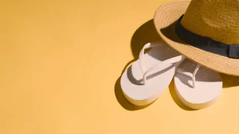 Summer Holiday Vacation Concept Of Flip Flops Sandals Sun Hat On Yellow Background 1