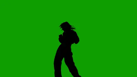 Studio Silhouette Of Woman Dancing Against Green Background 4