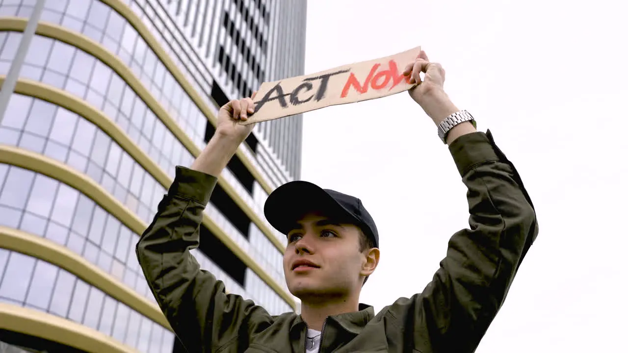 Close Up Of A Man Holding A Placard 3