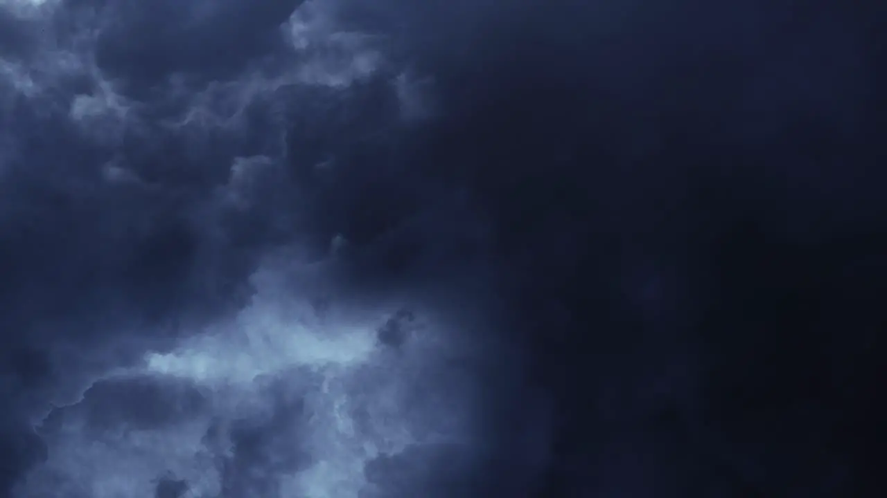 dark cumulonimbus clouds and thunderstorm