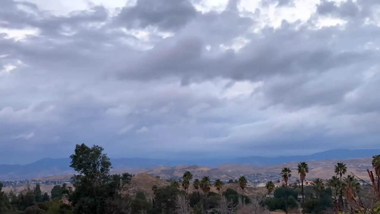 Time lapse of stormy clouds over remote Californian mountain city suburbs