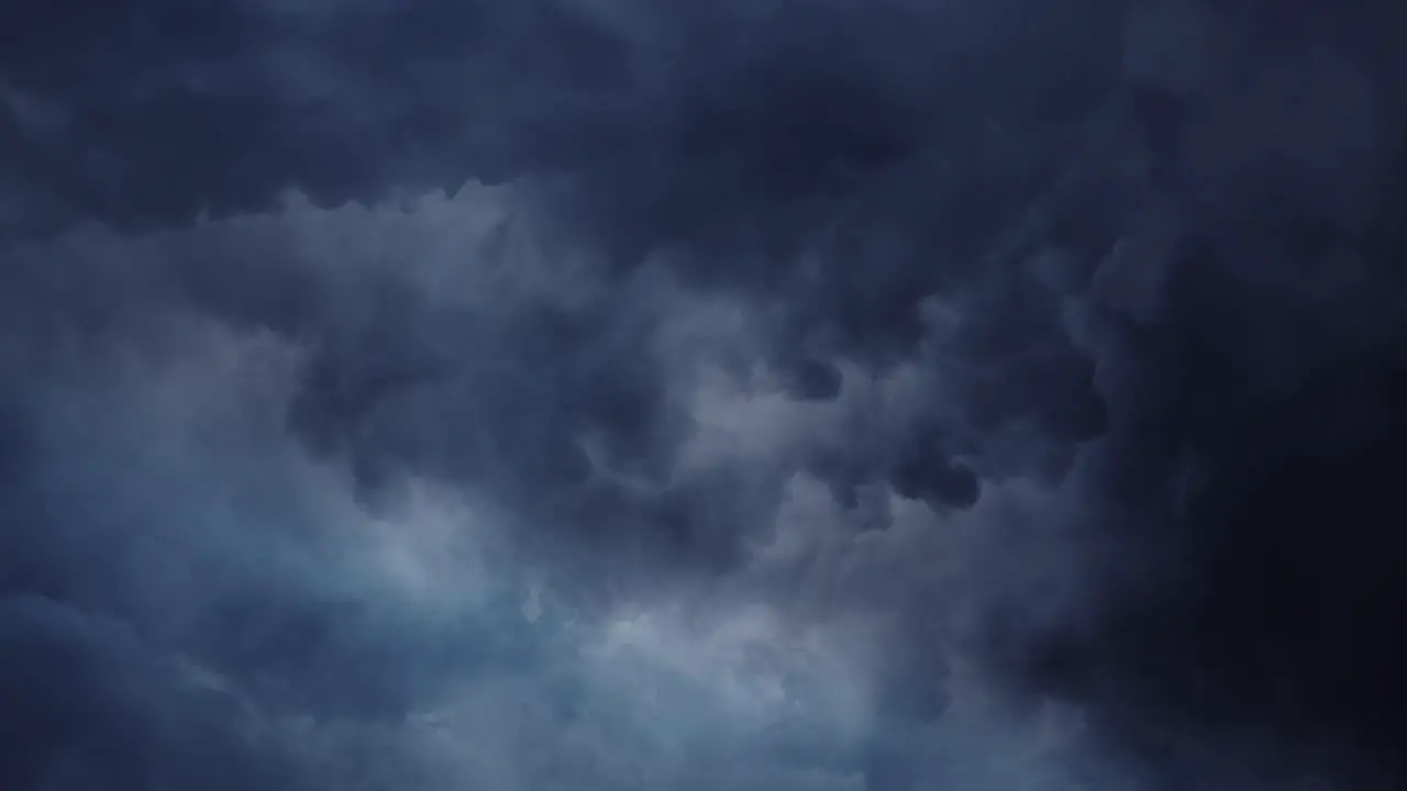 4k thunderstorm dark cloud clumps in the sky with lightning