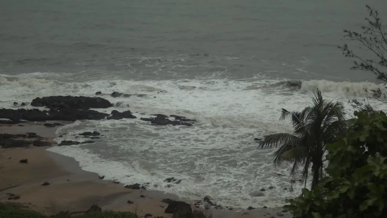 Stormy beach with crashing waves into the shoreline