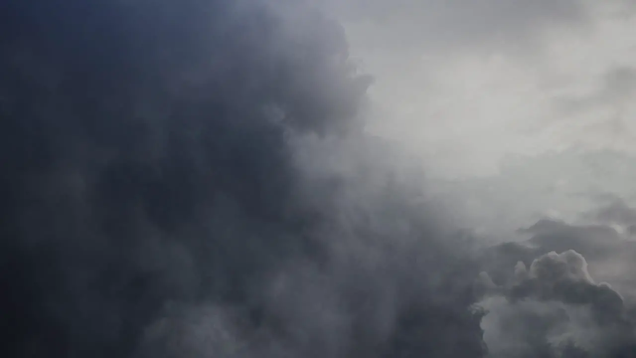 POV flying through dark and moving cumulonimbus clouds thunderstorm