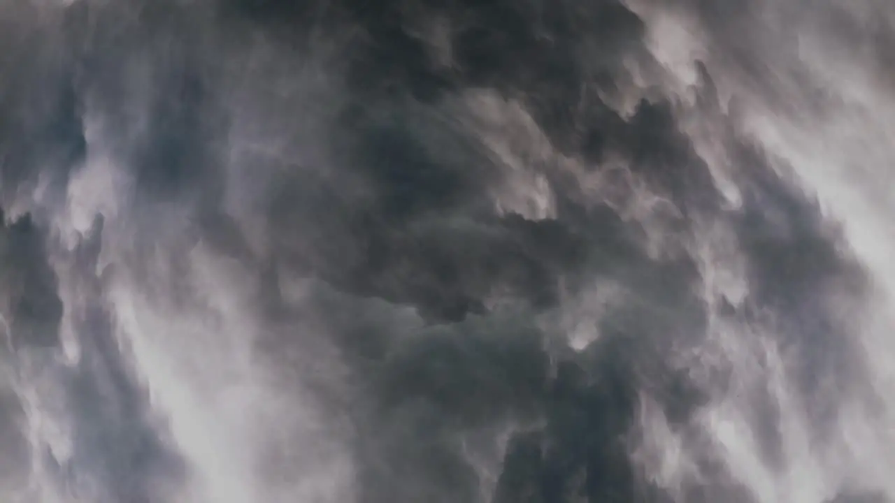 flying through thunderstorm inside dark gray clouds