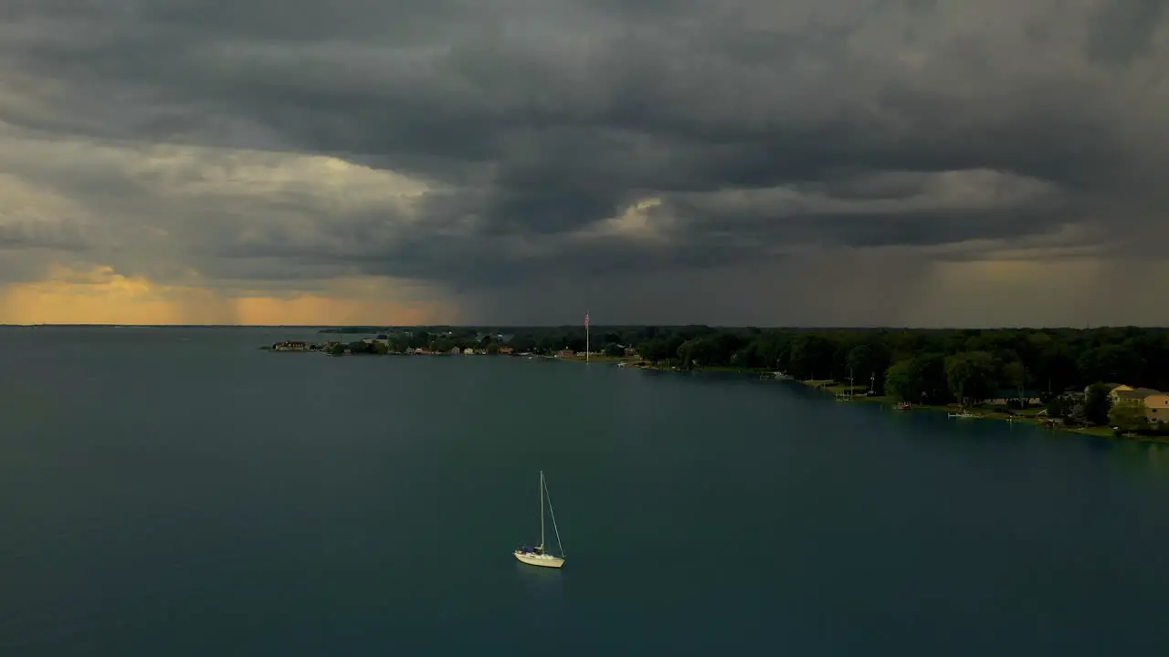 Sailboat anchored as storm rolls across lake