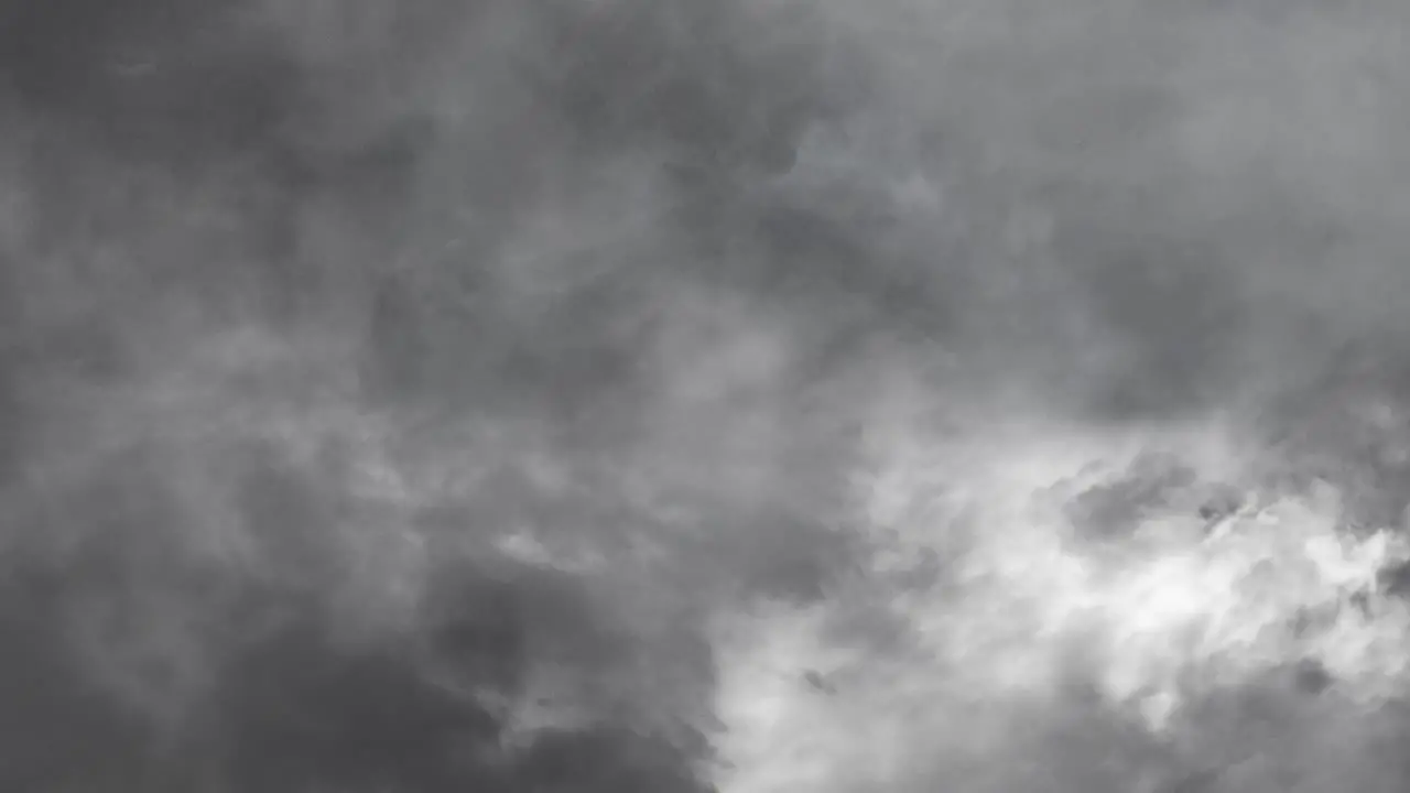 view of a thunderstorm in a dark gray sky