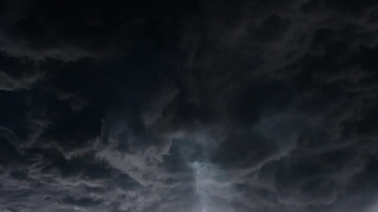 Lightning flashed inside the oncoming cumulus cloud a thunderstorm