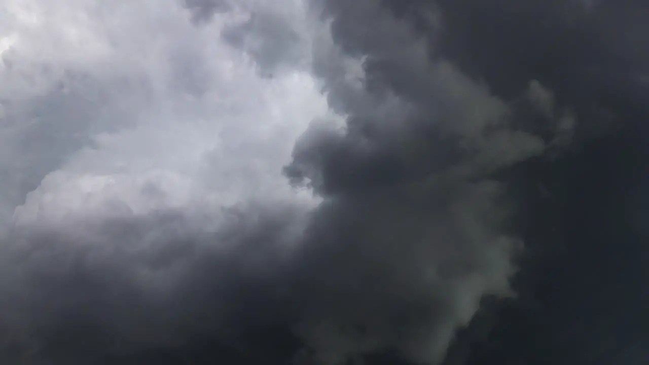 a thunderstorm inside a thick dark gray cloud