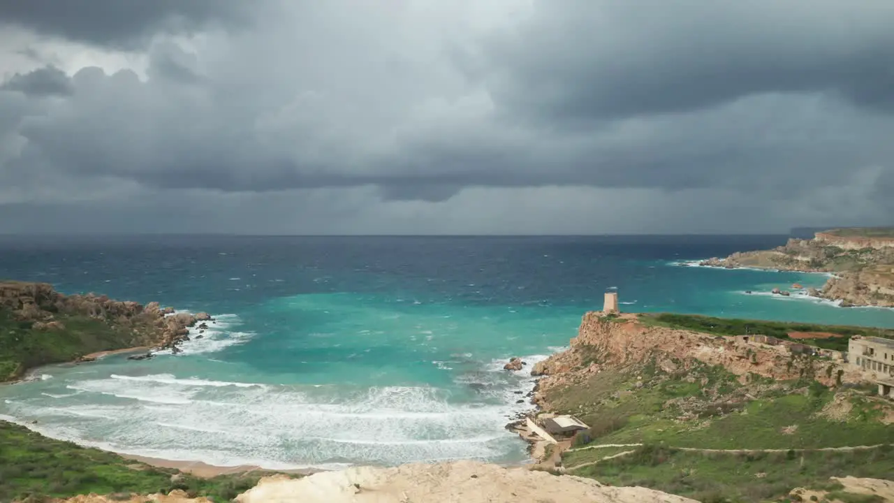 AERIAL Ghajn Tuffieha Bay with Sandy Beach and Upcoming Storm