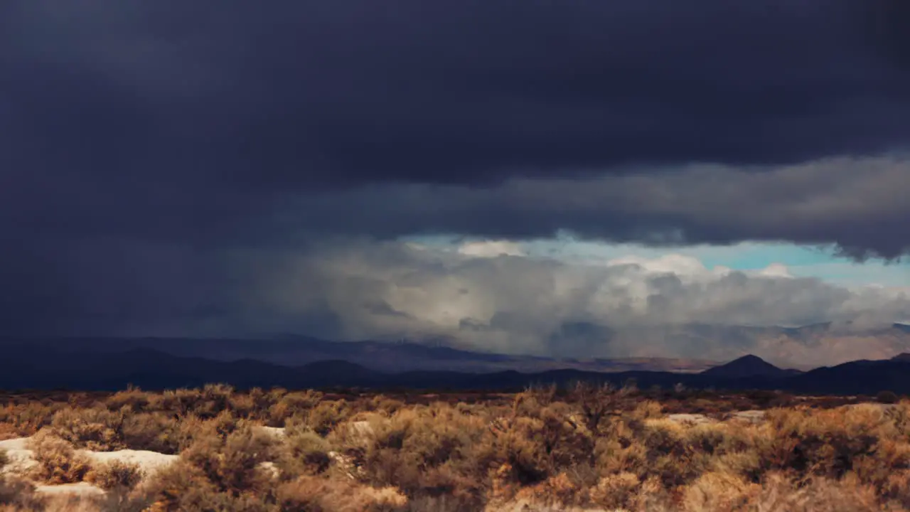 Time Lapse Storm Clouds Travel Over Desert And Mountains