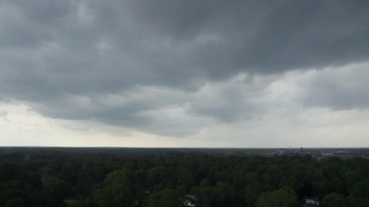 Drone captures a black cloud above the sky just before it begins to rain